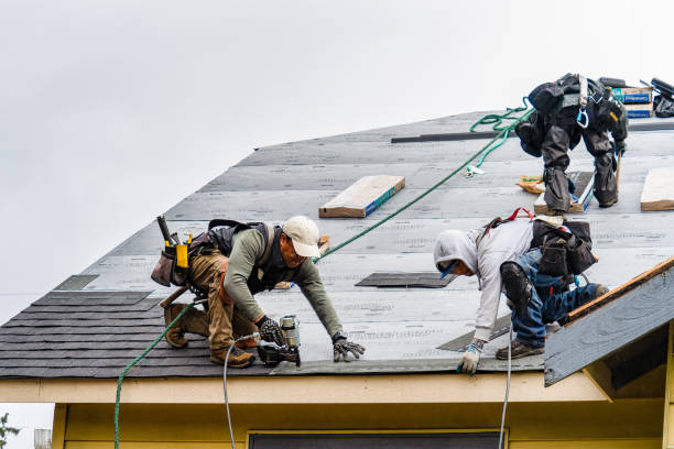 Professional Gutter Installation technician working in Mentone, CA
